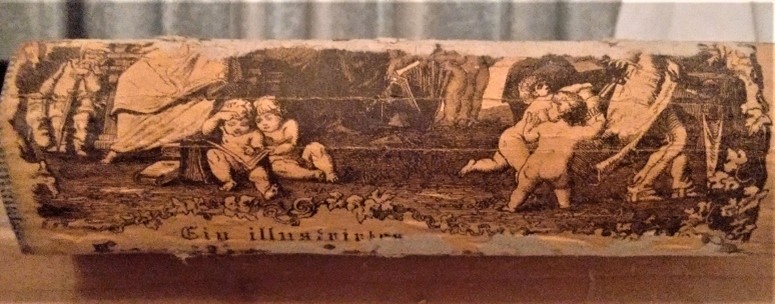 book spine with monochromatic image of cherubs playing