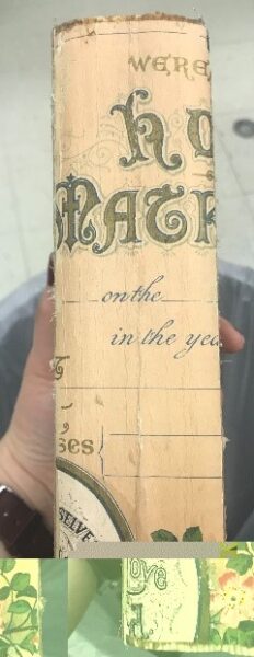 book spine with green lettering that looks like marriage certificate