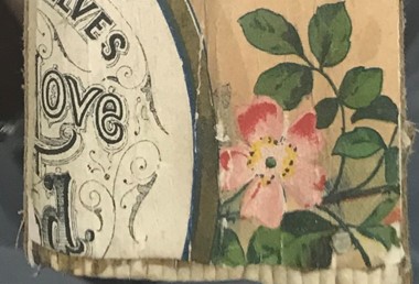 book spine with word "love" and rose

